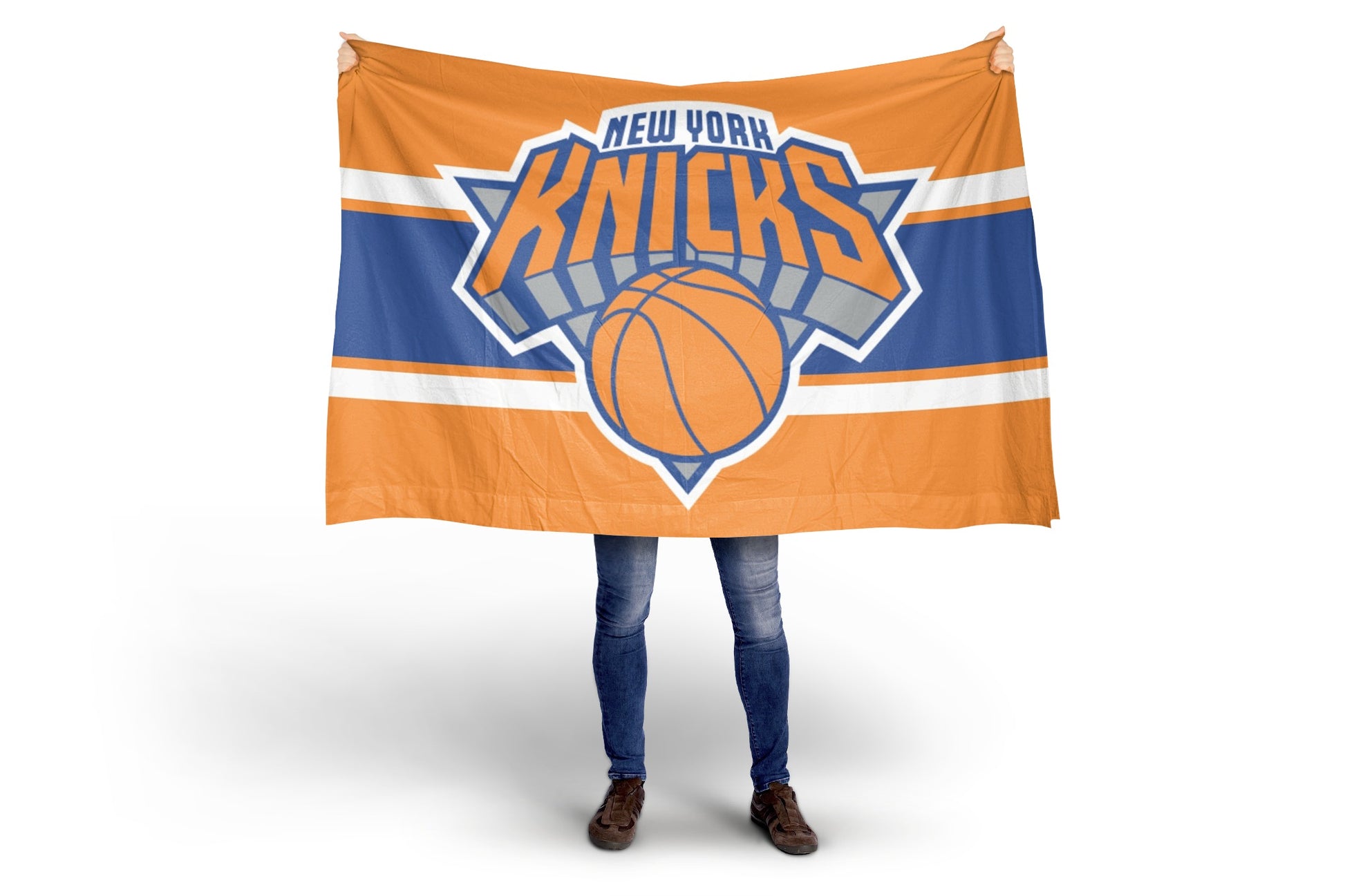 Person holding a New York Knicks flag on a white background