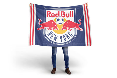 Person holding a Red Bull New York flag on a white background