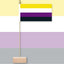 Nonbinary pride flag on a stick against a multicolored background