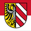 Nuremberg Flag. featuring a horizontal bicolor of red and white with the state coat of arms (a shield containing a black eagle on yellow and diagonal red and white stripes) in the center.