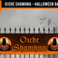 Halloween fence banner featuring the Irish Gaelic phrase 'Oíche Shamhna' in orange gothic lettering, flanked by black cat and jack-o'-lantern illustrations on an orange background, displayed on a black wrought-iron fence against a spooky gray background with silhouettes of a house, owl, and bats.