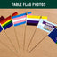 Collection of Pride-themed table flags on a wooden surface with 'Flags Ireland' branding.