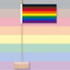 Philadelphia Pride flag on a wooden stand against a pastel striped background
