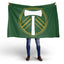 Person holding a green flag with a logo on a white background. Portland Timbers FC Flag.