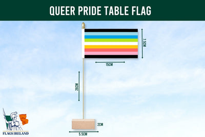 Queer pride table flag with dimensions on a blue background