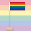 Rainbow flag on a pastel raibow colours background