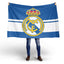 Person holding a large flag with a prominent logo on a white background