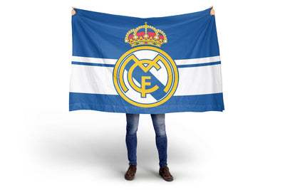 Person holding a large flag with a prominent logo on a white background