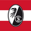 SC Freiburg Flag. A red, white, and black flag design with a central oval emblem featuring a black eagle head on a white side and a black-and-white split circle with the letters S and C on the other side.