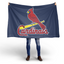 Person holding  a St. Louis Cardinals Flag