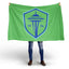 Person holding a green flag with a blue logo featuring the Space Needle and the year 1974 on a white .background. Seattle Sounders FC Flag- New 2024 Crest