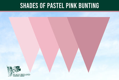 A graphic showing three overlapping pastel pink bunting pennants against a light blue sky background, with a dark green banner at the top reading 'SHADES OF PASTEL PINK BUNTING' and a 'Flags Ireland' logo in the lower left.