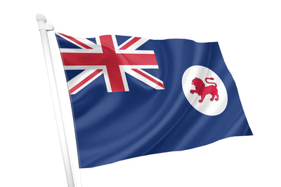 The flag of Tasmania is a British Blue Ensign featuring a blue field with the Union Jack in the upper left corner and a white disc (badge) in the fly (right side) containing a red lion passant. Officially proclaimed in 1876 and reaffirmed in 1975, the red lion represents the state's ties to the United Kingdom.