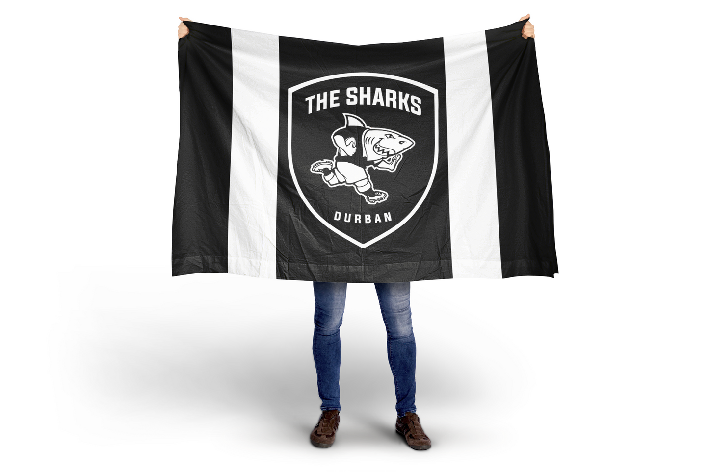 Person holding a black and white flag with 'The Sharks Durban' logo on a white background