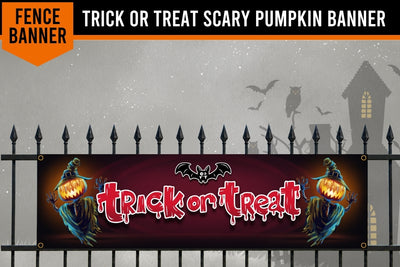 A Halloween-themed fence banner displayed on a black metal fence, featuring the words 'TRICK OR TREAT' in dripping red letters with jack-o'-lantern faces on both sides. The banner is shown against a spooky gray background with silhouettes of a haunted house, bats, and an owl.