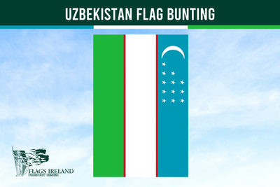 Uzbekistan flag bunting with a green, red, and blue design against a clear sky.
