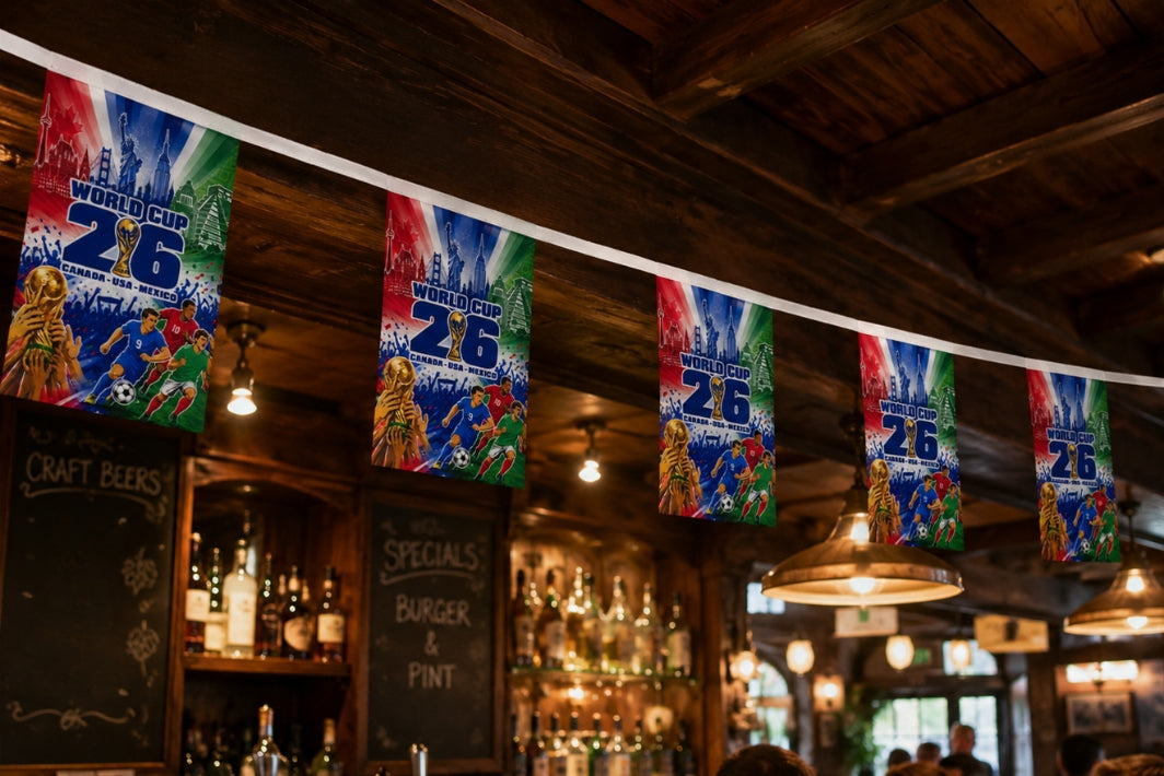 Decorative World Cup 2026 flags hanging in a bar with wooden beams and lighting fixtures.