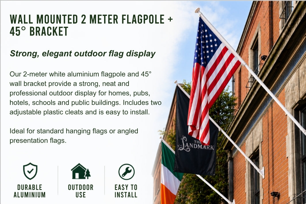 Wall mounted 2 meter flagpole with 45-degree bracket shown outdoors beside a brick building, with an American flag and a black 'The Landmark' banner flying. Text on the left describes the product features and includes icons for durable aluminium, outdoor use, and easy to install.