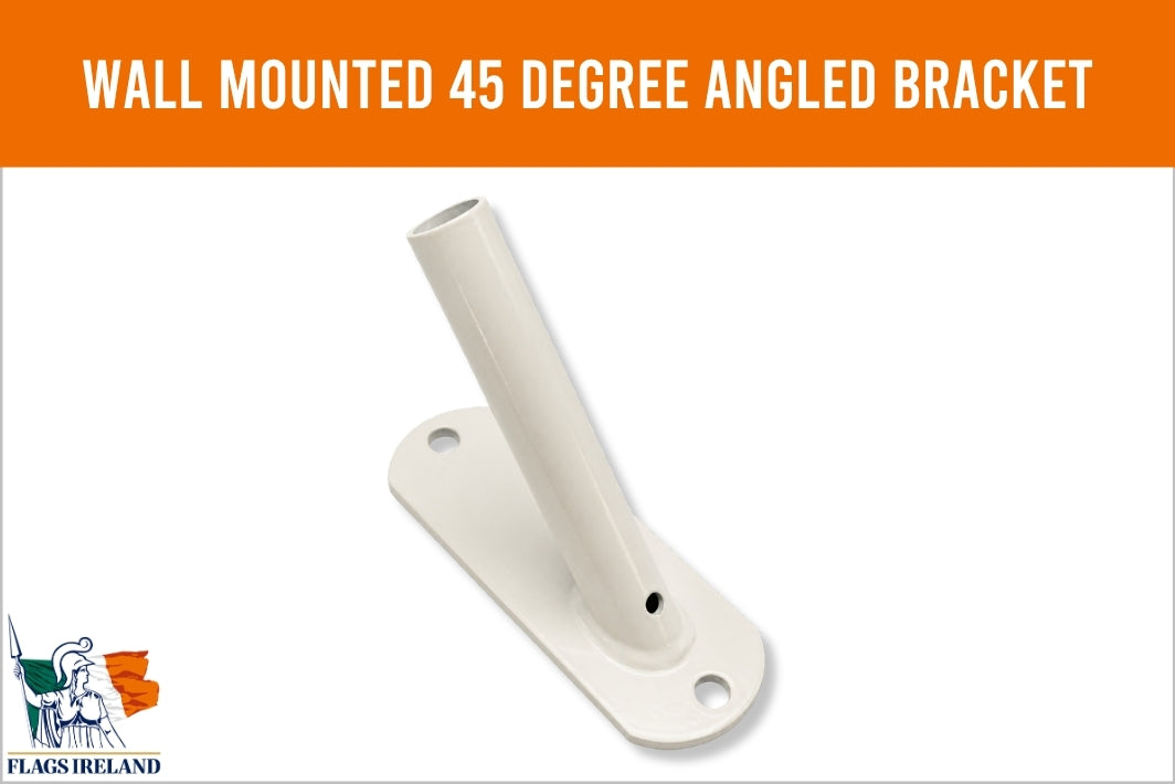 A white wall-mounted 45-degree angled bracket with a flat mounting plate and cylindrical pole, shown on a white background with an orange header reading 'WALL MOUNTED 45 DEGREE ANGLED BRACKET' and a small 'Flags Ireland' logo in the lower left.