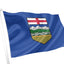 Flag of Alberta waving on a white background