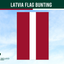 Latvia flag bunting with two red and one white stripe against a blue sky background, branded by Flags Ireland.