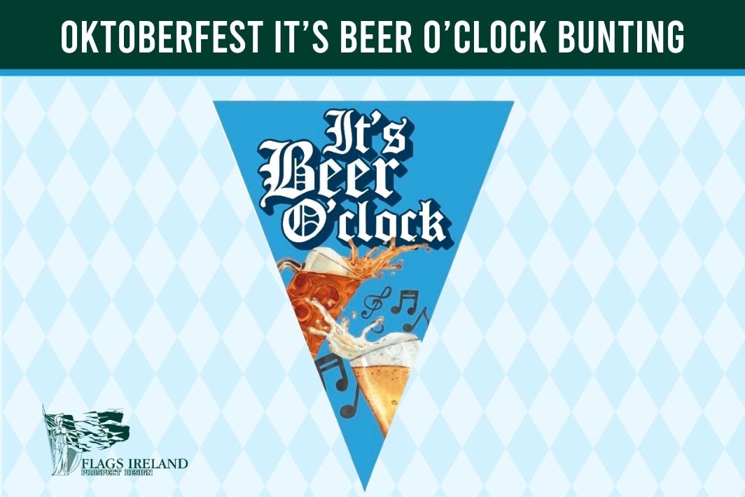 A triangular pennant banner design with the text 'It's Beer O'clock' in white gothic lettering, featuring an illustration of an orange beer glass with foam and musical notes, set against a blue background. The banner is displayed on a light blue and white harlequin patterned background with a dark green header banner reading 'OKTOBERFEST IT'S BEER O'CLOCK BUNTING' and a 'Flags Ireland' logo in the bottom left.
