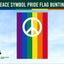 Peace symbol pride flag bunting with rainbow colors against a blue sky, branded with Flags Ireland.