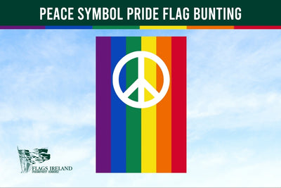 Peace symbol pride flag bunting with rainbow colors against a blue sky, branded with Flags Ireland.