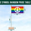Rainbow pride table flag with peace symbol against a clear blue sky