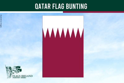 Qatar flag bunting with a clear blue sky background
