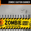 A Halloween-themed zombie caution banner displayed on a black metal fence against a spooky gray background with a haunted house silhouette. The banner features a yellow and black striped hazard pattern with distressed black text reading 'ZOMBIE CAUTION BANNER', 'PROHIBITED ENTRY', 'ZOMBIE INSIDE', and 'CAUTION: INFECTED ZONE'.